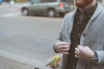 Man with Red Beard Wearing Grey Cardigan on Street