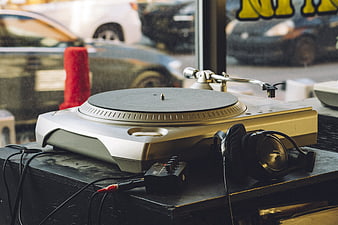 Vintage Turntable and Headphones on Wooden Table
