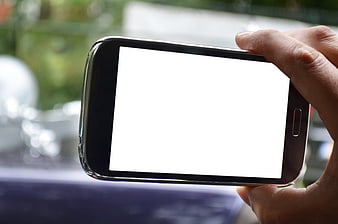 Hand Holding Smartphone with Blank White Screen Mockup
