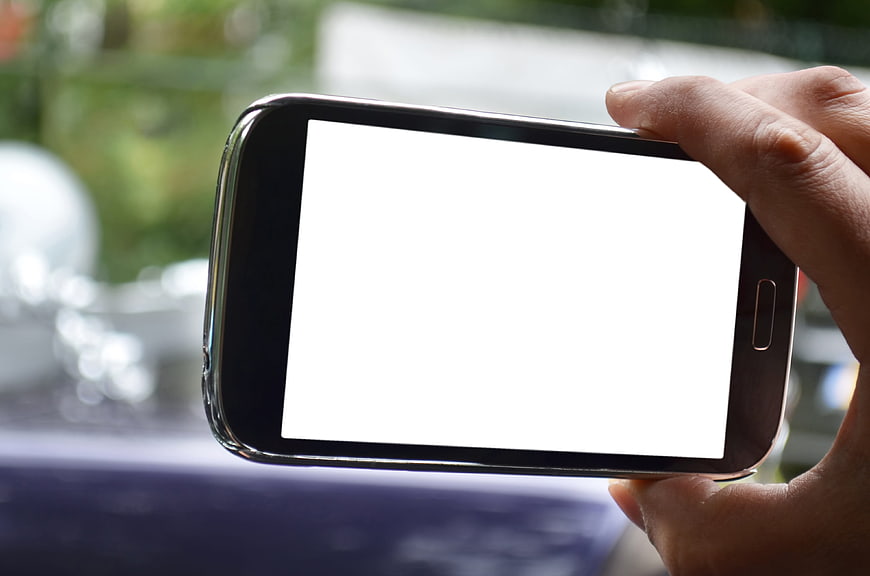 Hand Holding Smartphone with Blank White Screen Mockup