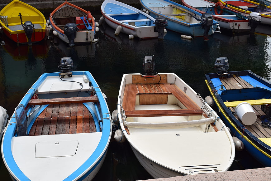 Colorful wooden boats docked in a harbor