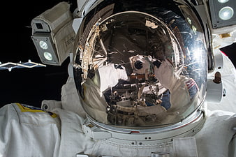 Astronaut Helmet Reflection in Space with ISS Background