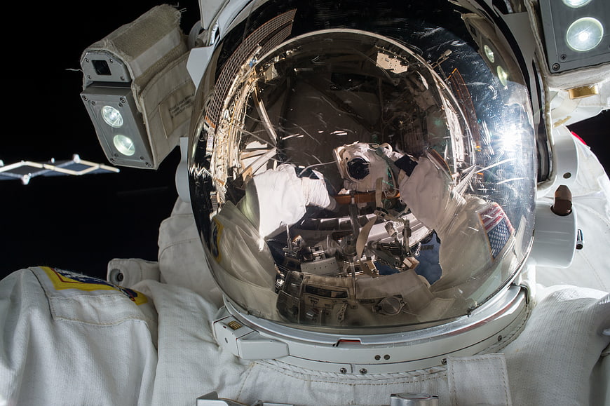 Astronaut Helmet Reflection in Space with ISS Background