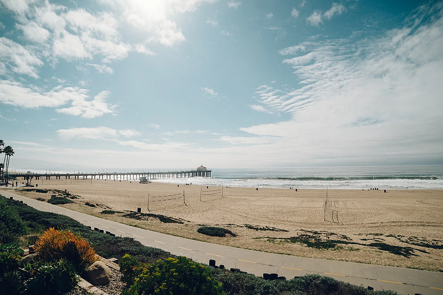 Huntington Beach Pier and Volleyball Courts on Sunny Day