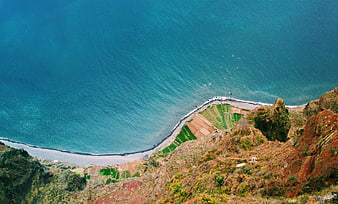 Aerial View of Terraced Banana Plantations on a Volcanic Coastline