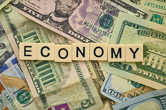 Economy spelled with letter tiles on US dollar bills