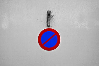No Parking Sign on Gray Garage Door with Handle