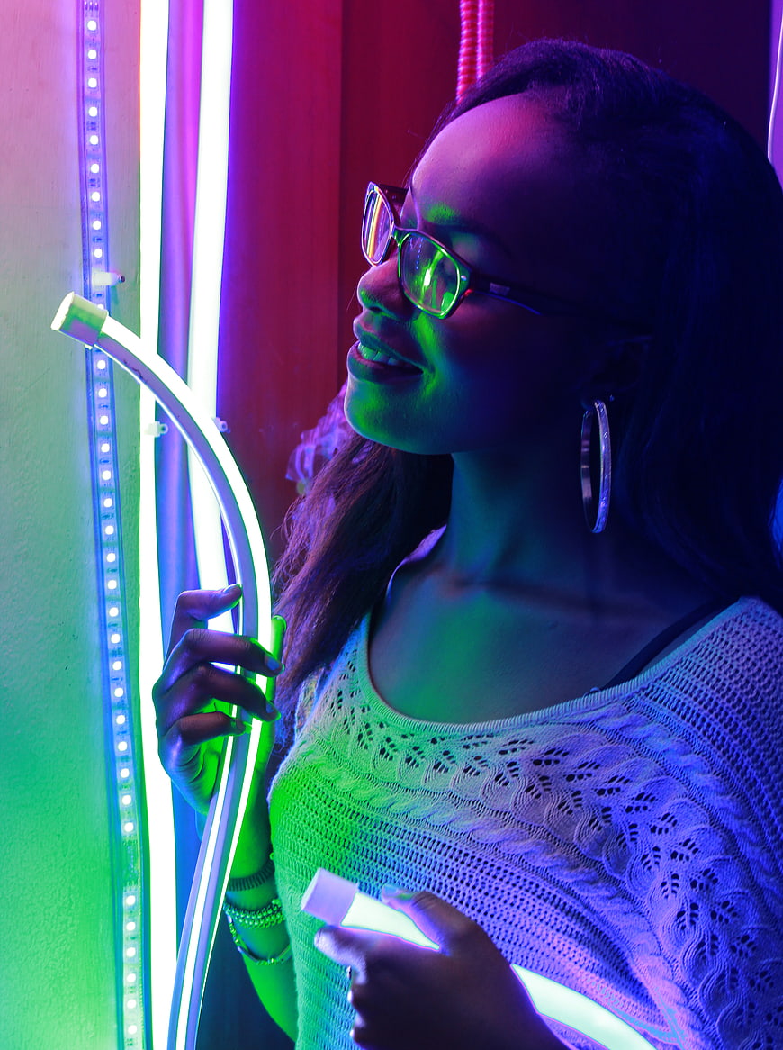 Woman with Neon Lights and Glowing Tube