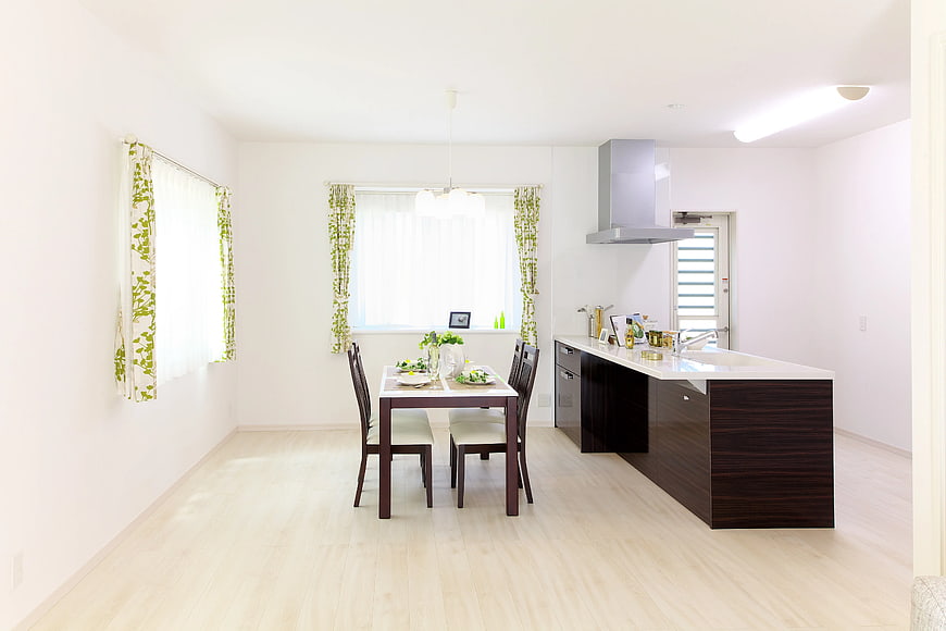 Bright Modern Kitchen and Dining Room Interior with Wooden Table