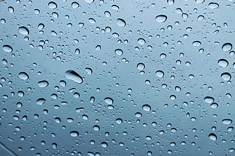 Raindrops on Glass Window Background