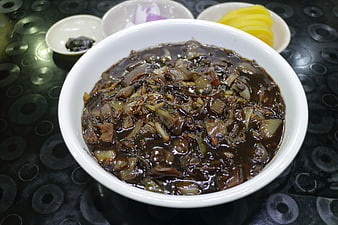 Bowl of Korean Jajangmyeon Sauce with Pickled Radish