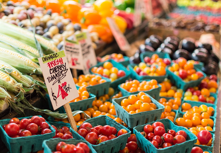 Fresh Organic Cherry Tomatoes and Corn at Farmers Market
