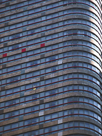 Curved Modern Skyscraper Facade with Red Accents