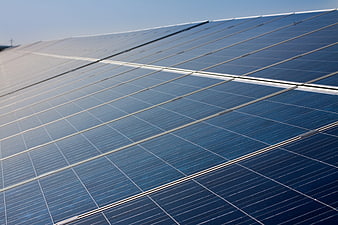Close-up of blue solar panels under clear sky