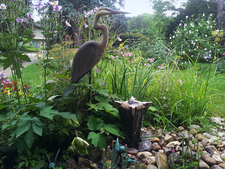 Garden bird statue and water fountain feature