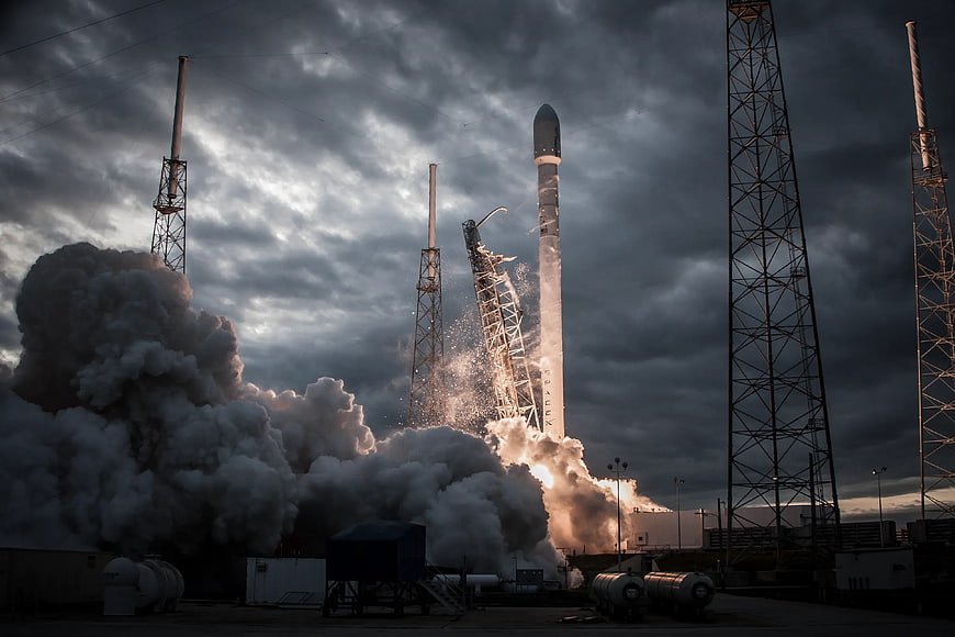 SpaceX Falcon 9 Rocket Launch with Dramatic Clouds