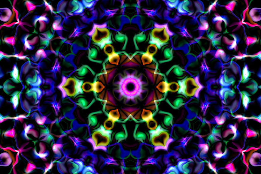 Vibrant neon kaleidoscope pattern with symmetrical geometric design