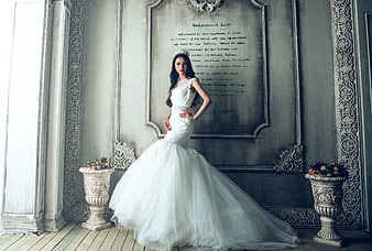 Bride in White Mermaid Wedding Dress Standing in Vintage Room