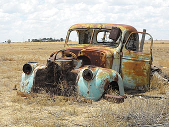 Rusted Vintage Truck Wreck in Dry Australian Outback Landscape