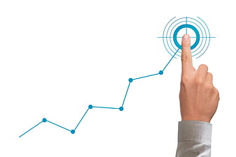 Businessman Hand Pointing At Target On Rising Growth Chart