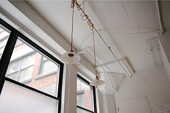 Industrial Loft Interior with Vintage Pendant Lights and Windows