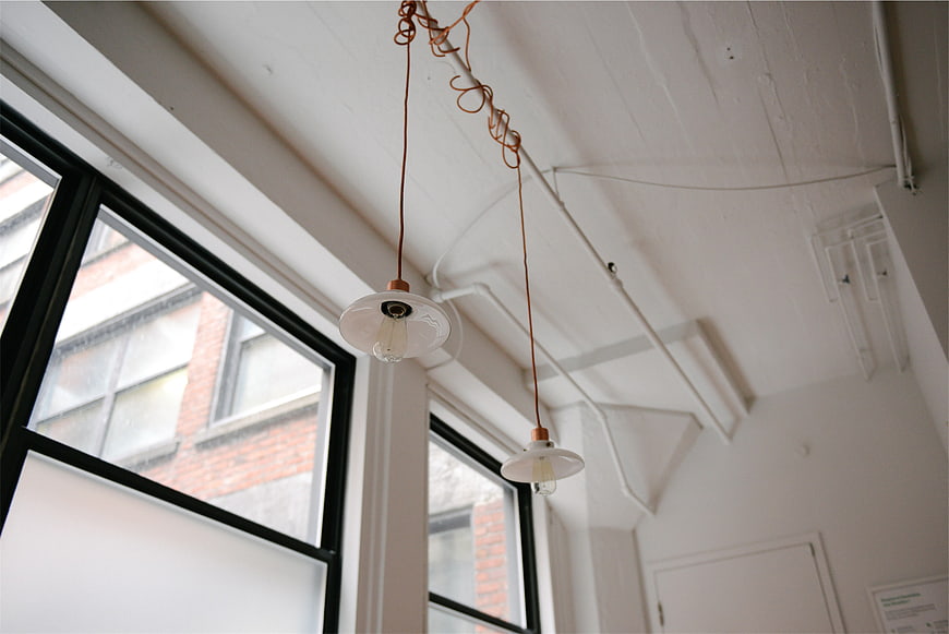 Industrial Loft Interior with Vintage Pendant Lights and Windows