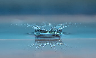 Water Drop Splash Crown Reflection Blue Background
