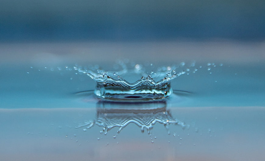 Water Drop Splash Crown Reflection Blue Background