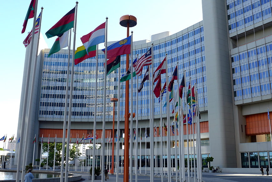 International flags flying in front of the United Nations Vienna headquarters