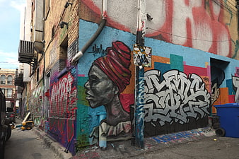 Colorful Graffiti Mural on Urban Brick Wall