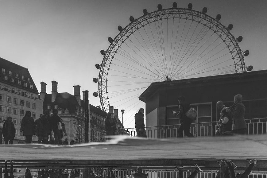 Black and White London Eye with Pedestrians and Reflection