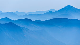 Blue Distant Mountain Layers in Misty Atmosphere