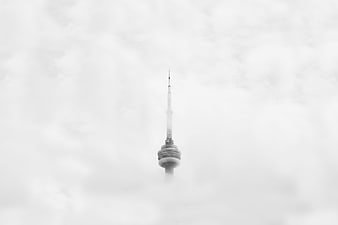 CN Tower Emerging from Thick Fog in Black and White