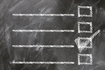 Chalkboard checklist with checkmark and empty lines