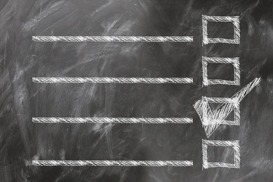 Chalkboard checklist with checkmark and empty lines