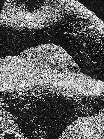 Black and white texture of sand and pebbles