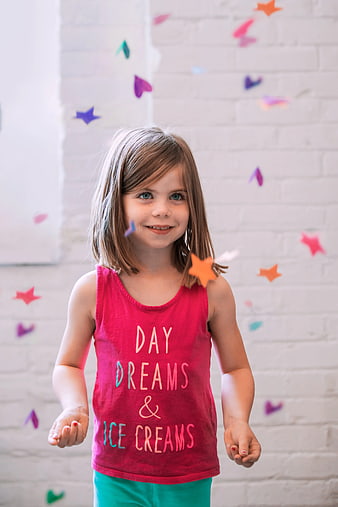 Happy Girl in Red Tank Top with Confetti