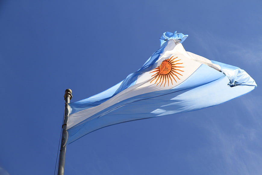 Argentine National Flag Waving Against Clear Blue Sky
