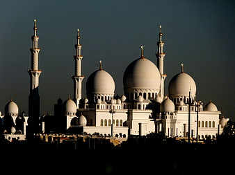Sheikh Zayed Grand Mosque illuminated at dusk in Abu Dhabi, UAE