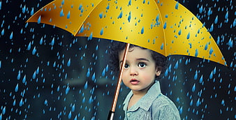 Child with Yellow Umbrella in Rain