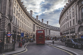 Red Double-Decker Bus Driving Through London Regent Street