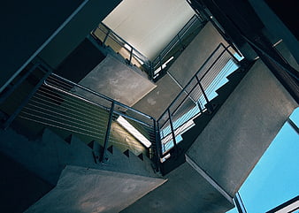 Low Angle View of Concrete Staircase with Metal Railings