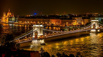 Illuminated Chain Bridge and Parliament at Night in Budapest