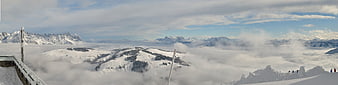 Panoramic View of Snowy Alps Above Sea of Clouds