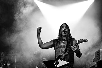 Rock Vocalist Singing with Guitar on Stage