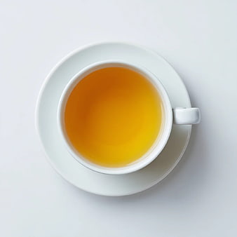 Top View of Golden Herbal Tea in White Cup