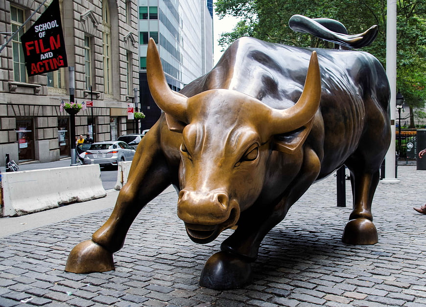 Charging Bull Statue on Cobblestone Street in New York City
