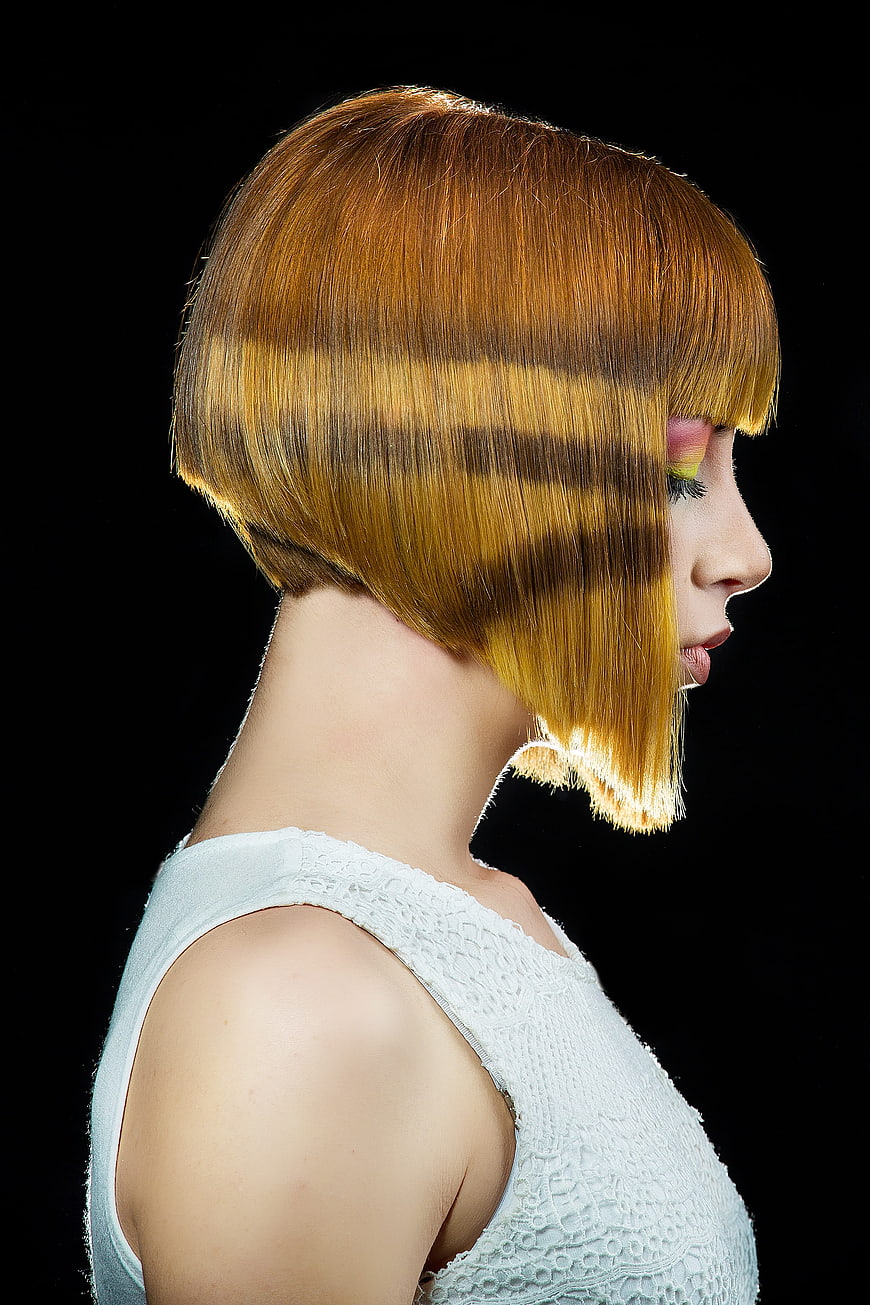 Woman with striped shadow pattern on blonde bob haircut