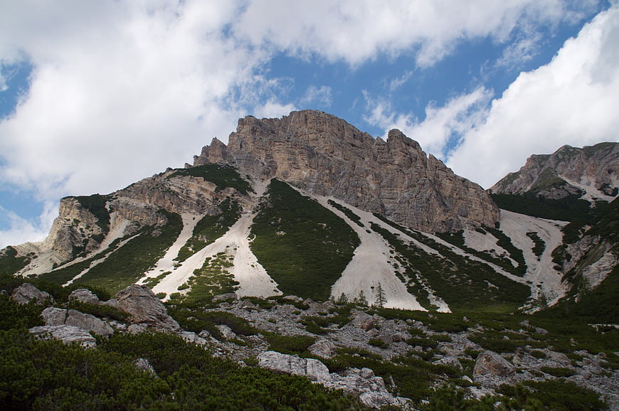 Majestic Dolomites Mountain Peak with Snow Patches and Blue Sky