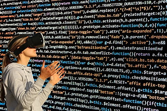 Woman wearing VR headset interacting with virtual code background